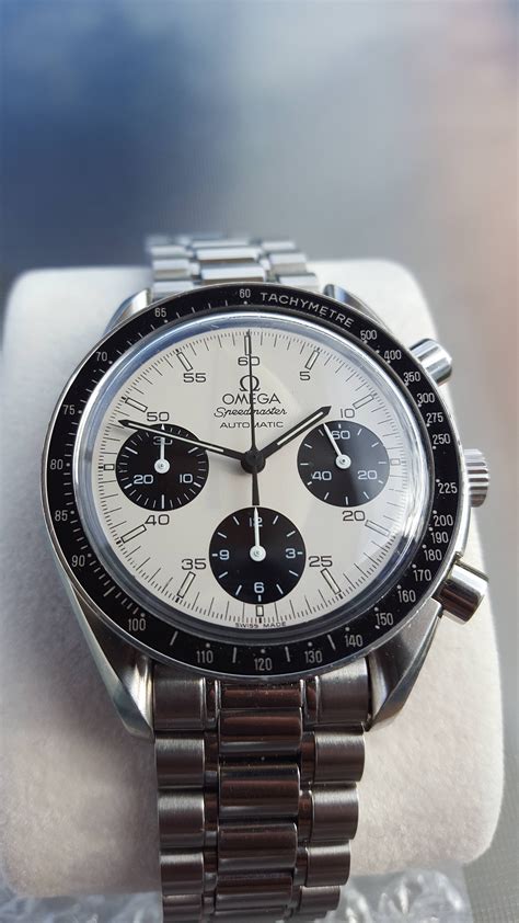 omega speedmaster white dial price.